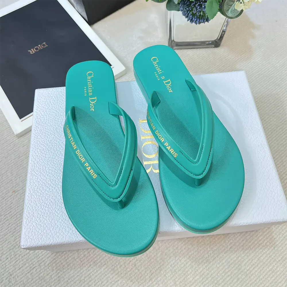 Close-up of silver Dior hardware on Diorsea Thong Sandal Aquamarina