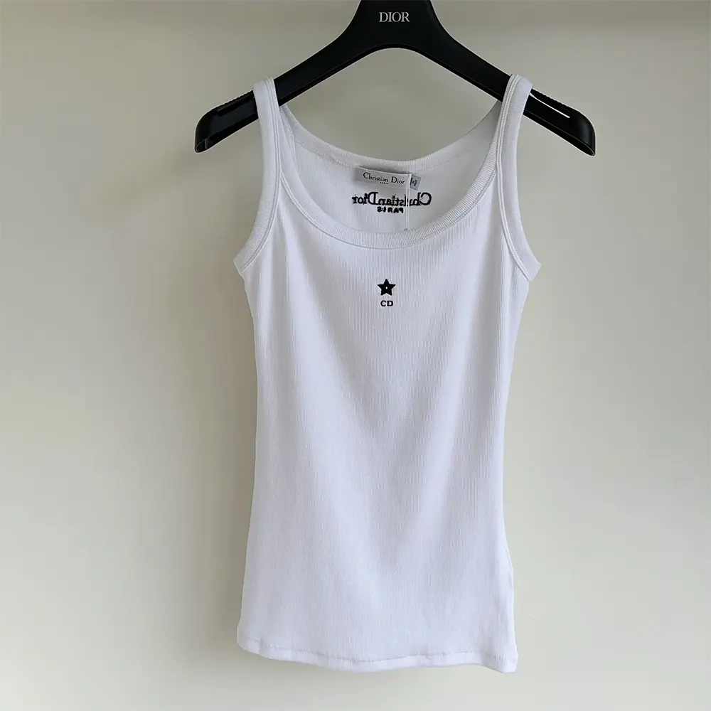 Close-up of ribbed cotton texture on Dior white tank top
