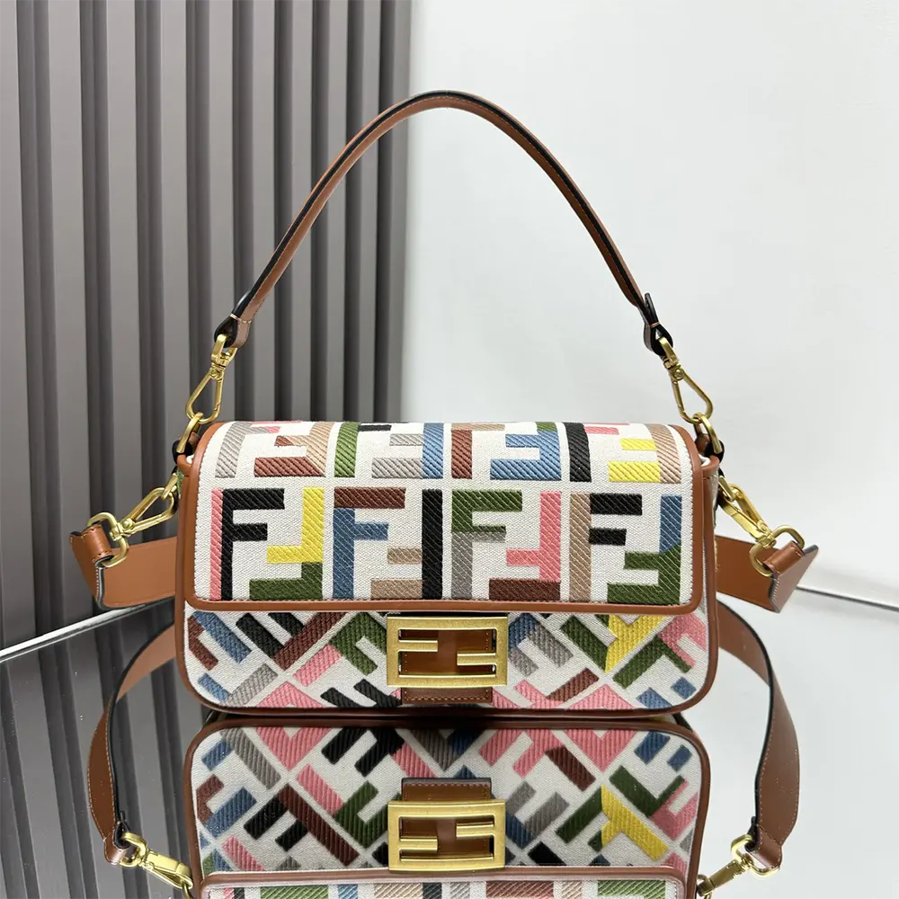 Close-up of gold hardware and embossed FF embroidery on Fendi baguette bag