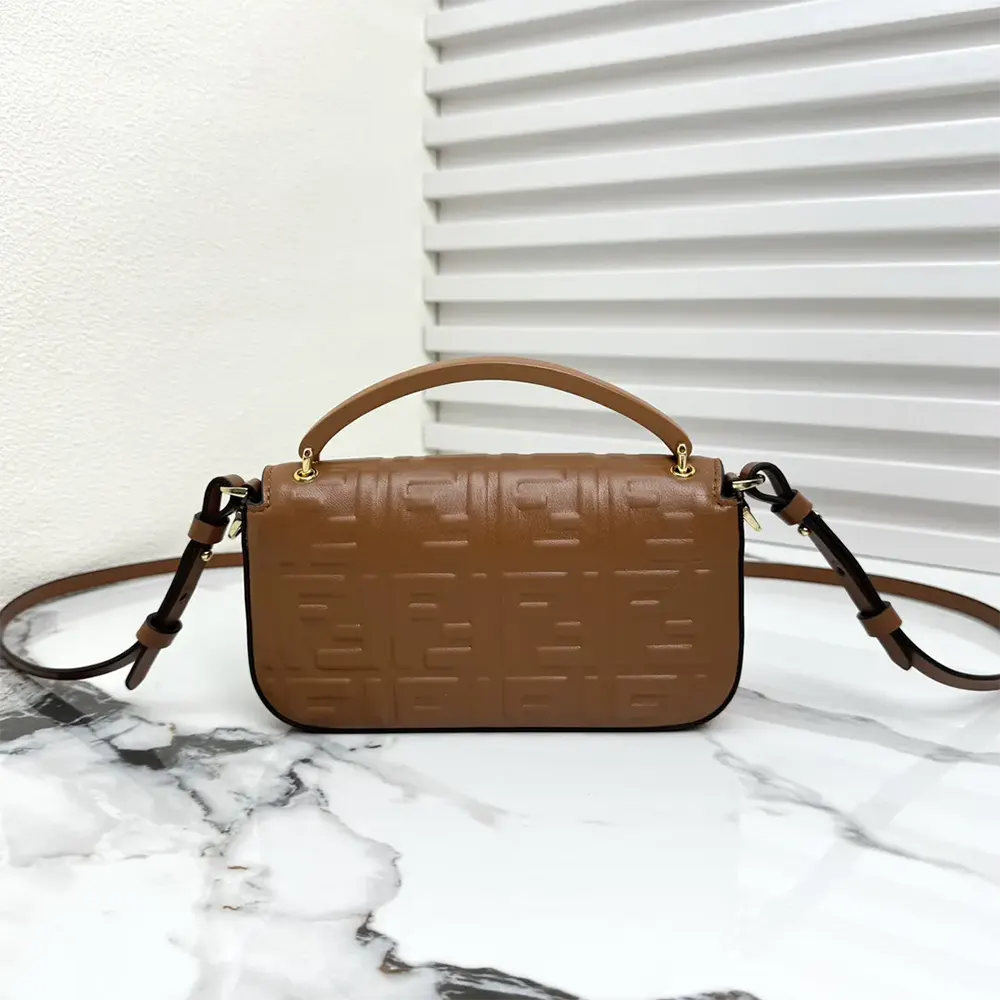 Side view showing slim profile of Fendi Women Baguette Phone Pouch Brown Nappa Leather Pouch