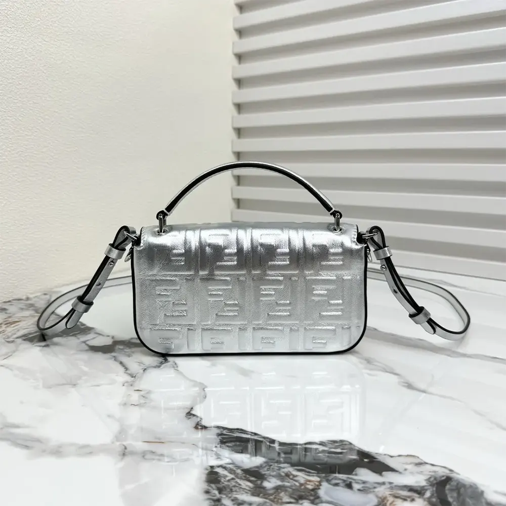 Side angle showing compact silhouette of Fendi Women Baguette Phone Pouch