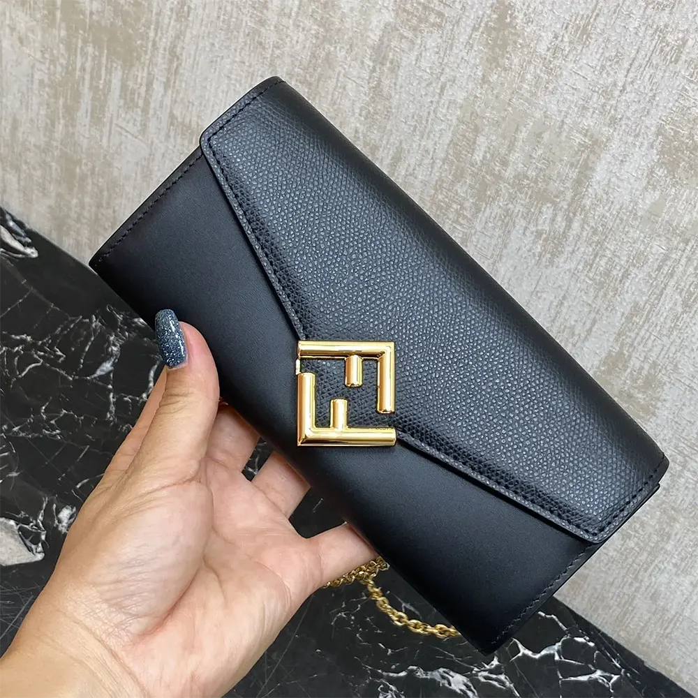 angled shot showing gold-tone chain and clasp on Fendi Women black wallet