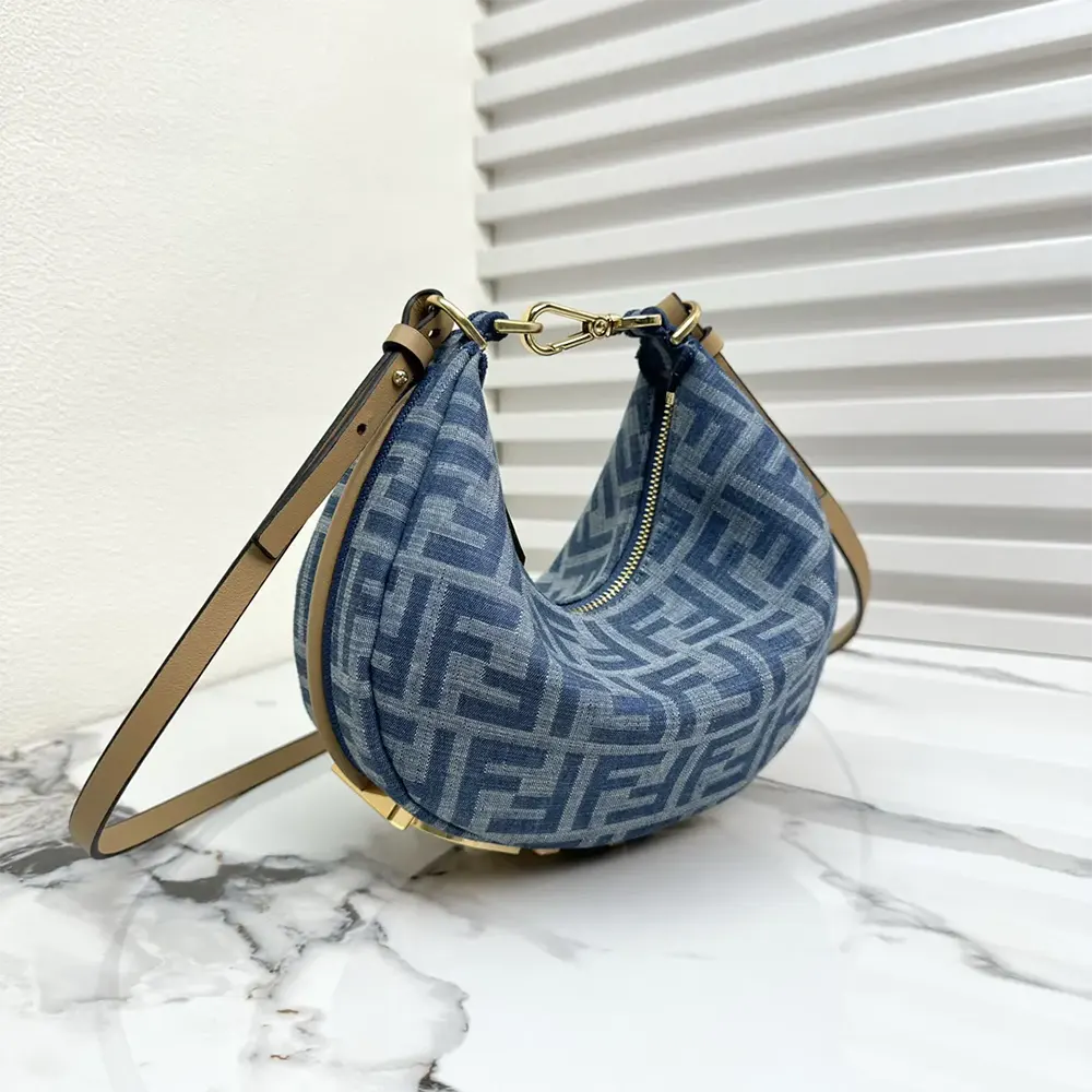 Side angle showing flap closure on Fendi Women Fendigraphy Mini Denim Bag
