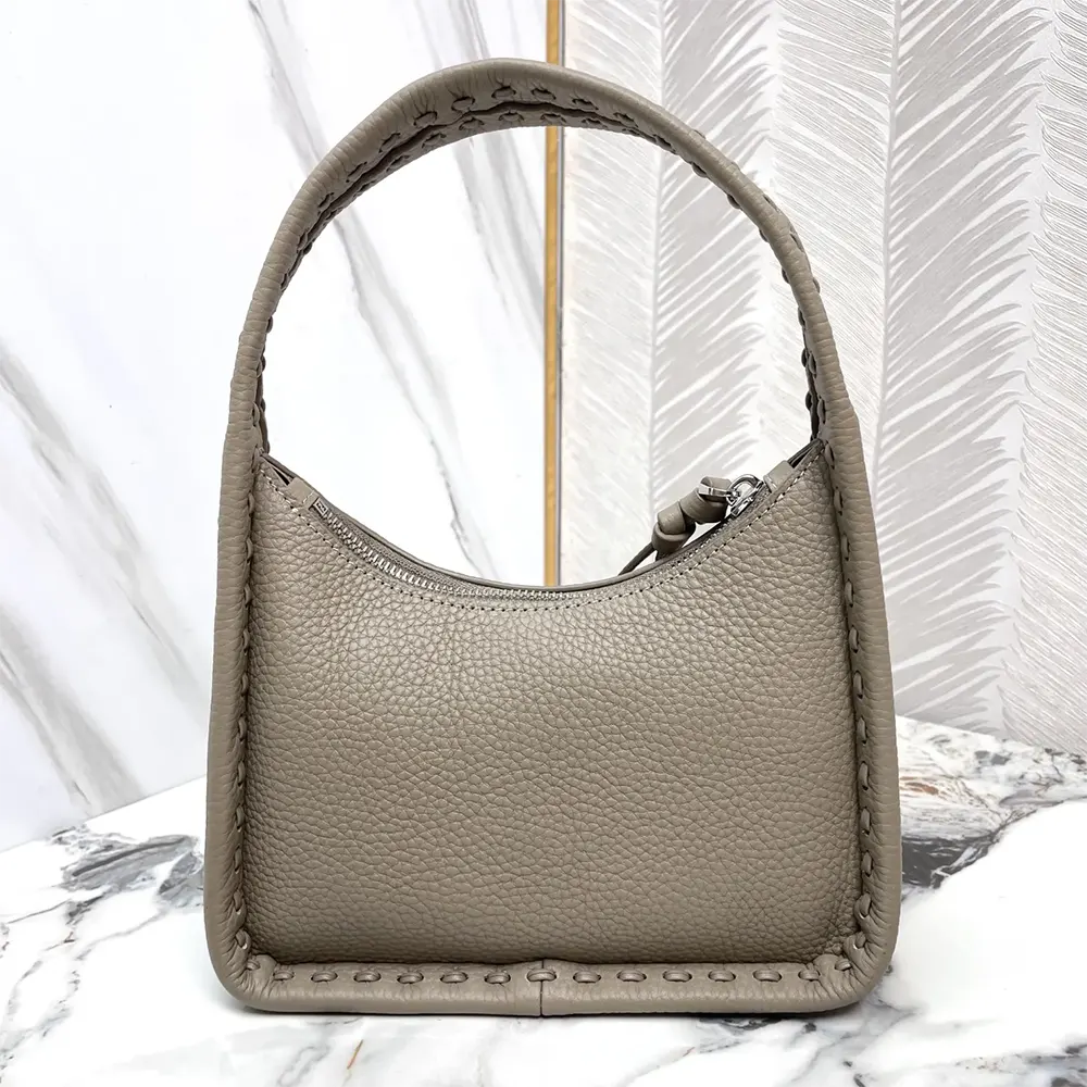 Side angle showing gold-tone hardware on Fendi Mini Fendessence bag