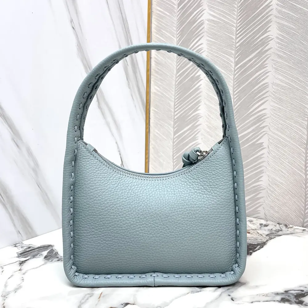Side angle showing silver-tone hardware on Fendi Mini Fendessence bag