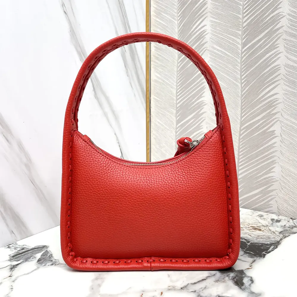 Side angle showing compact silhouette of Fendi Mini Fendessence Small Red Selleria Bag