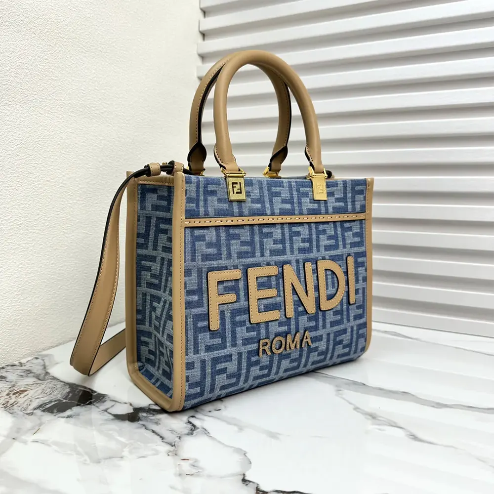 Side angle showing zip closure and denim texture of Fendi Sunshine shopper