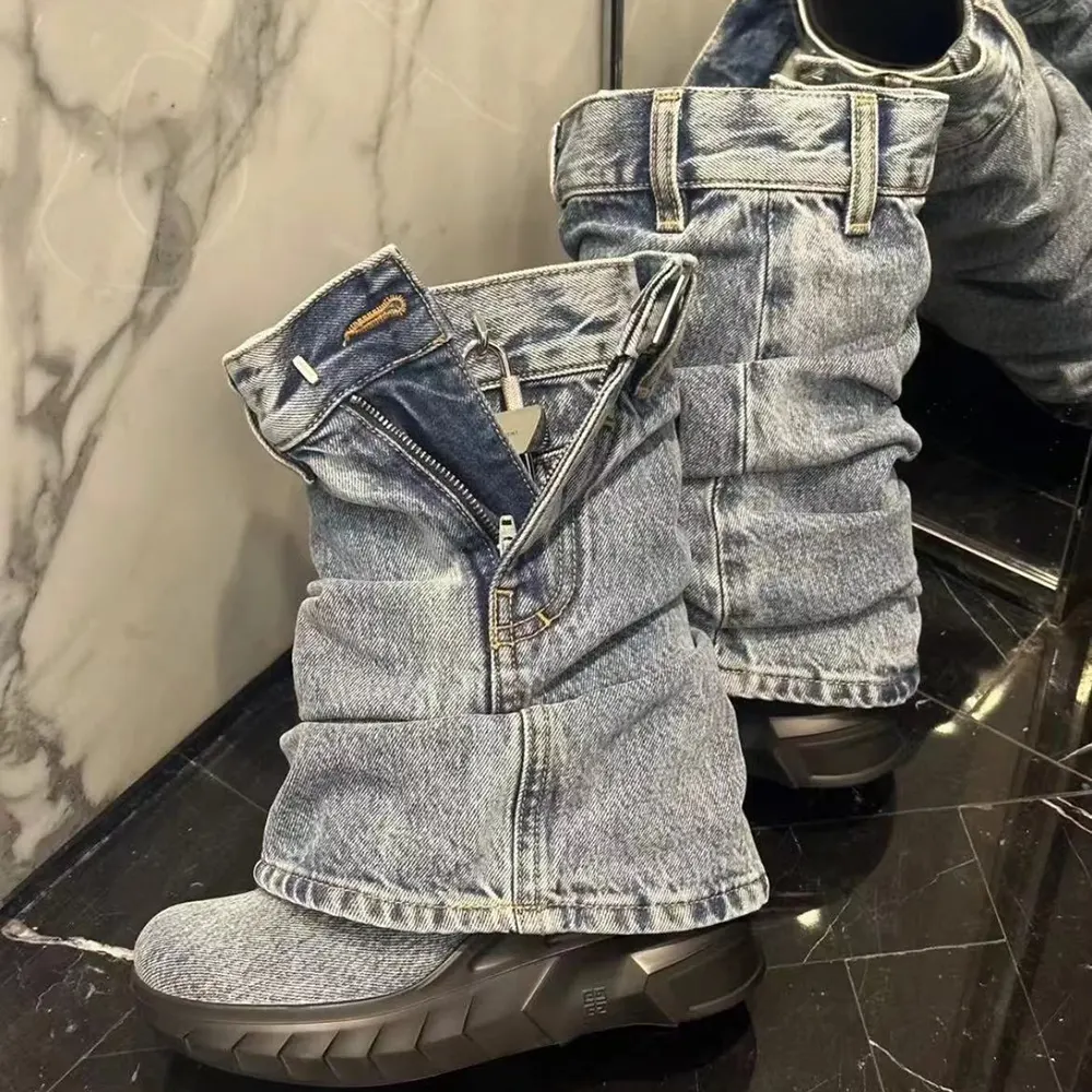 Front angled shot of Givenchy Women Shark Lock Biker Ankle Boots in Jeans