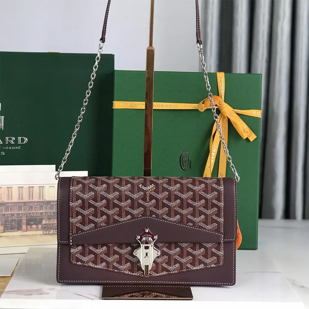 Close-up of gold hardware and signature Chevron pattern on Goyard Unisex Duchesse Marie Caroline Bag-Maroon