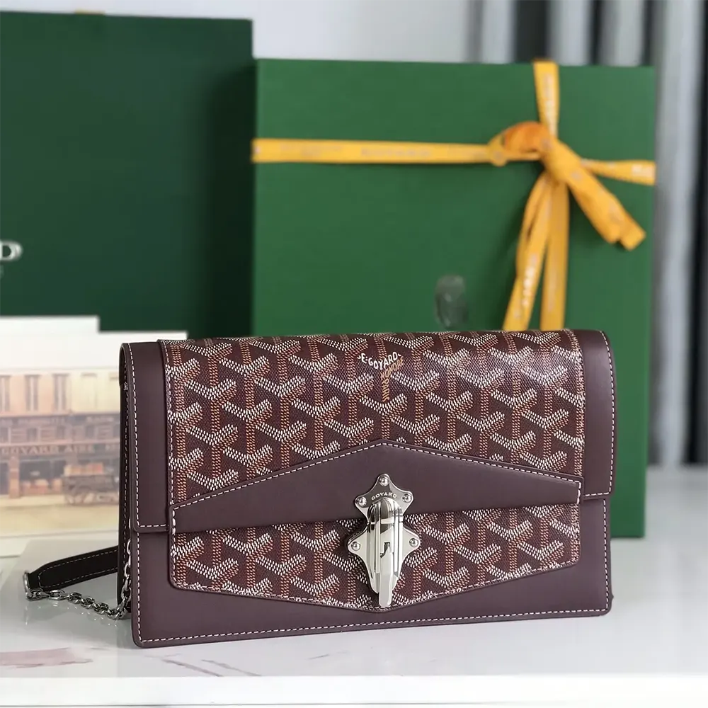 Side angle highlighting adjustable strap and leather trim of Goyard Unisex Duchesse Marie Caroline Bag-Maroon