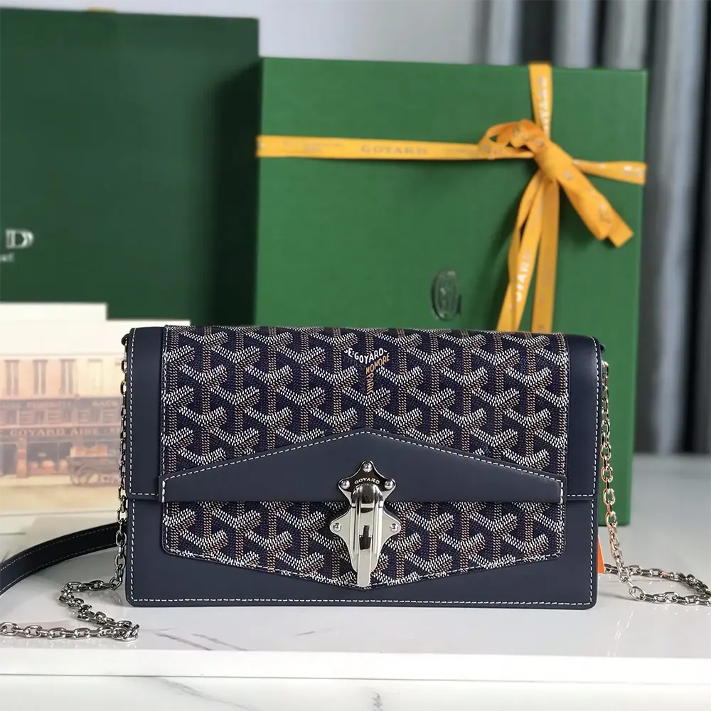Close-up of brass hardware and chevron print on Goyard Duchesse Marie Caroline Bag-Navy