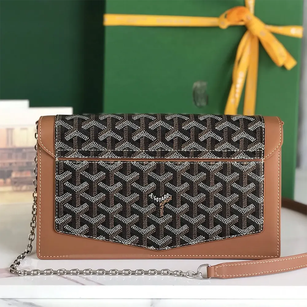 Side angle showing leather trim and flap closure of Goyard Duchesse Marie Caroline bag