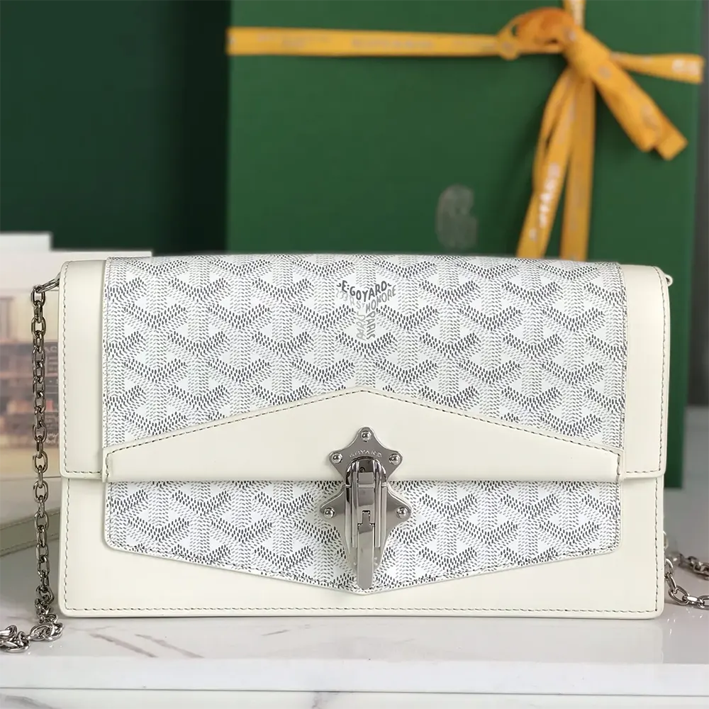 Close-up of white coated canvas and leather trim on Goyard Duchesse Marie Caroline Bag