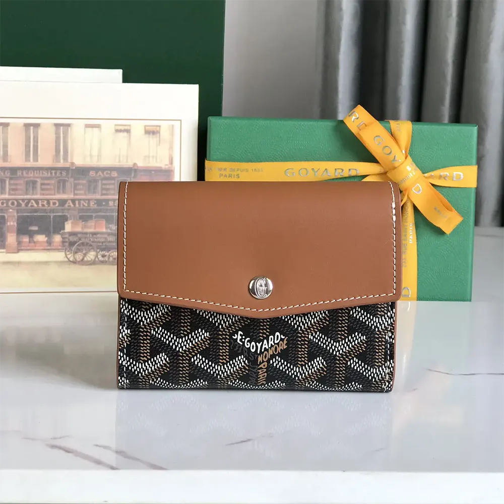 Close-up of tan leather trim and brushed gold snap on Goyard Saint Gabrie Wallet