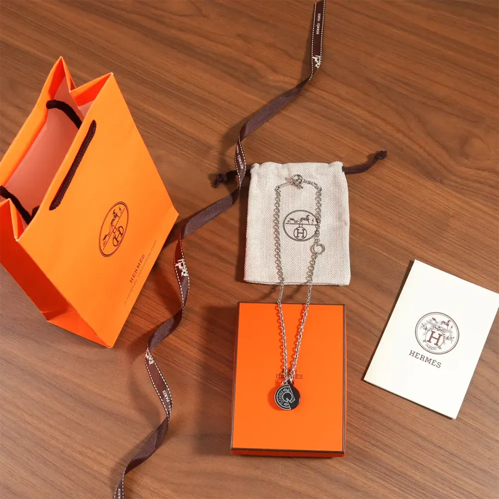 Hermes Unisex Carrousel Necklace displayed flat showcasing length and clasp