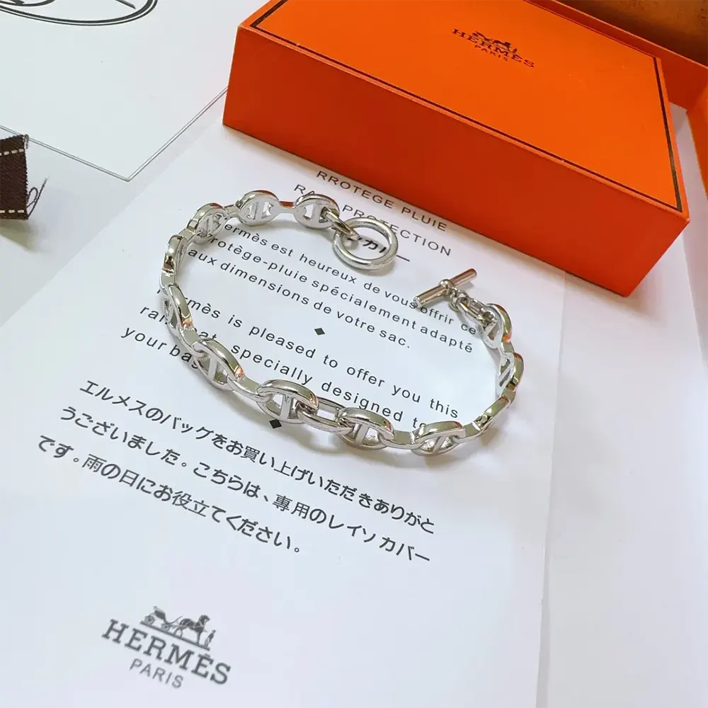 Styled shot of Hermes Unisex Chaine D Ancre Enchainee Bracelet Small Model on wrist