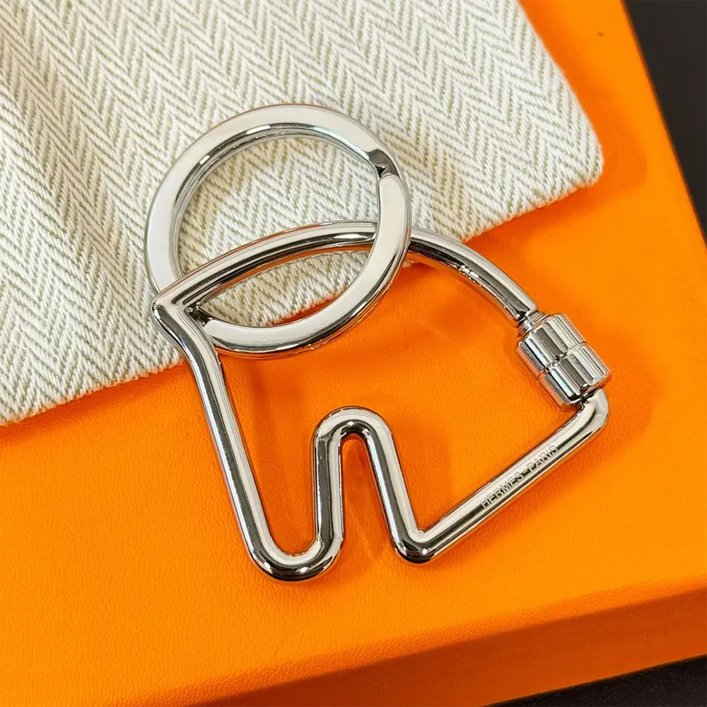 Side angle of Hermes Unisex Cheva Key Ring showing clasp mechanism