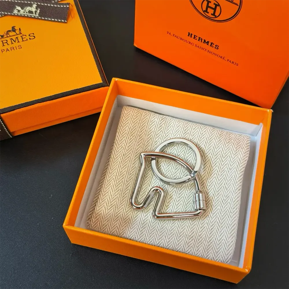 Close-up of Hermes Unisex Cheva Key Ring signature cheval detail