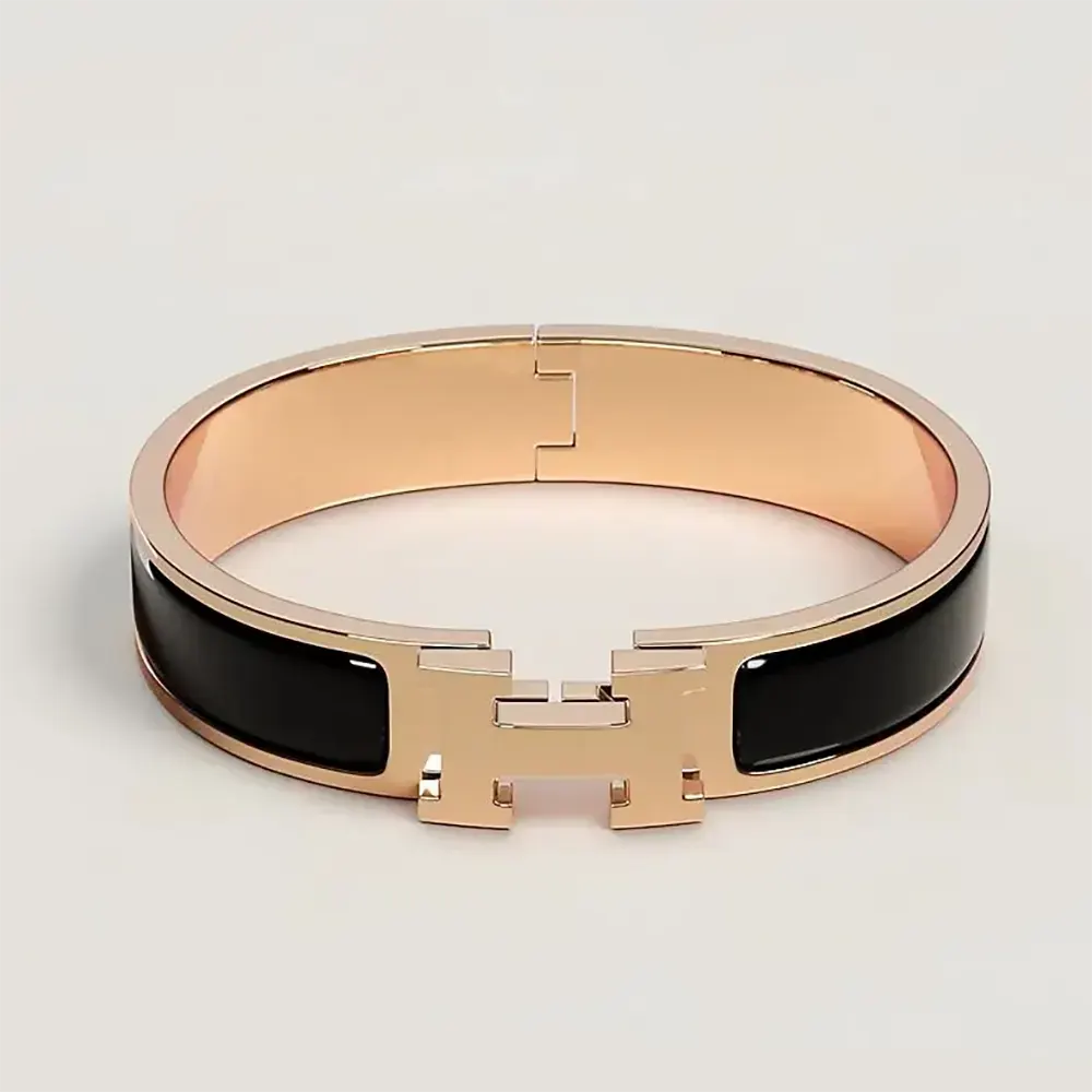 Close-up of Hermes Unisex Clic H Bracelet-Black gold clasp detail