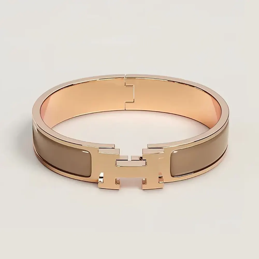 Close-up of Hermes Unisex Clic H Bracelet-Brown showing H clasp detail