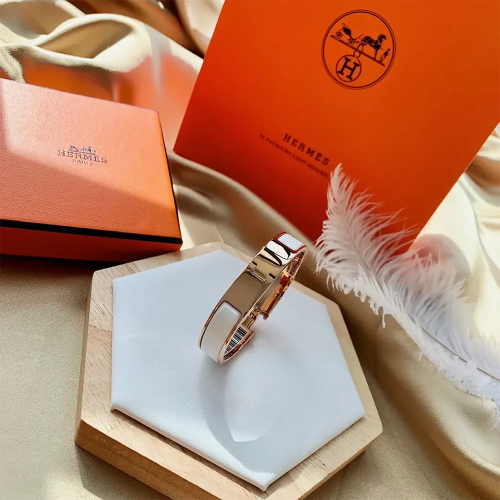 Hermes Unisex Clic H Bracelet-White worn on wrist with outfit