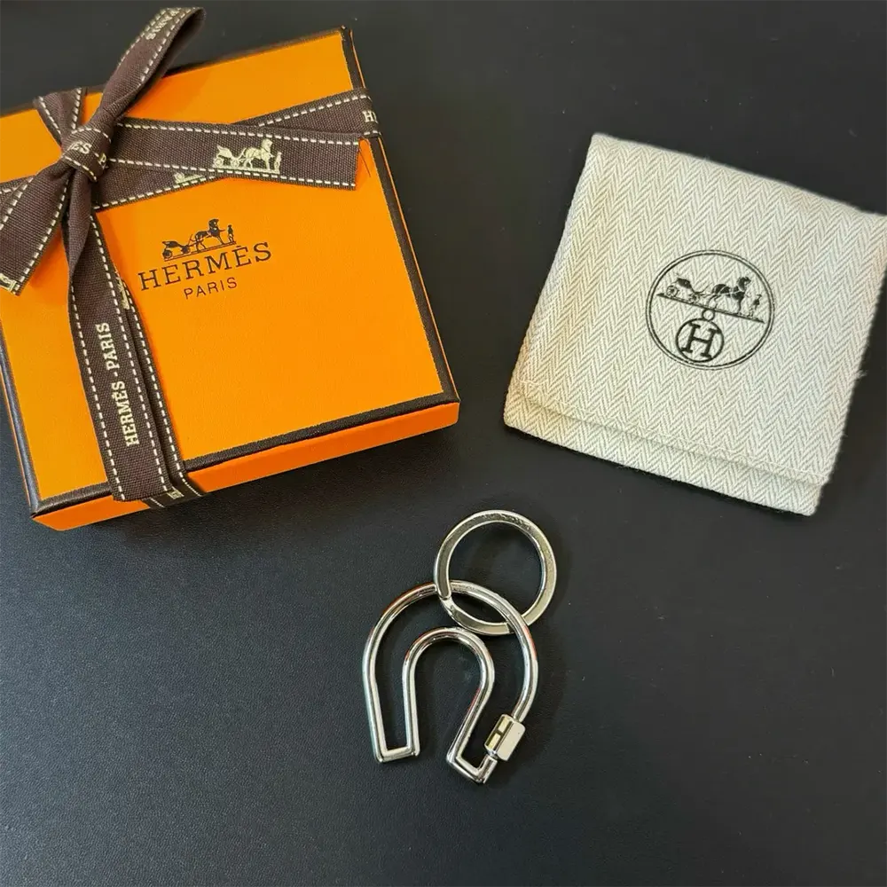 Close-up of signature horseshoe detail on Hermes Unisex Fer A Cheval Key Ring