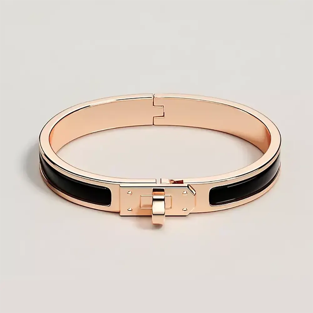 Close-up of Hermes Unisex Mini Clic Kelly Bracelet-Black gold clasp detail