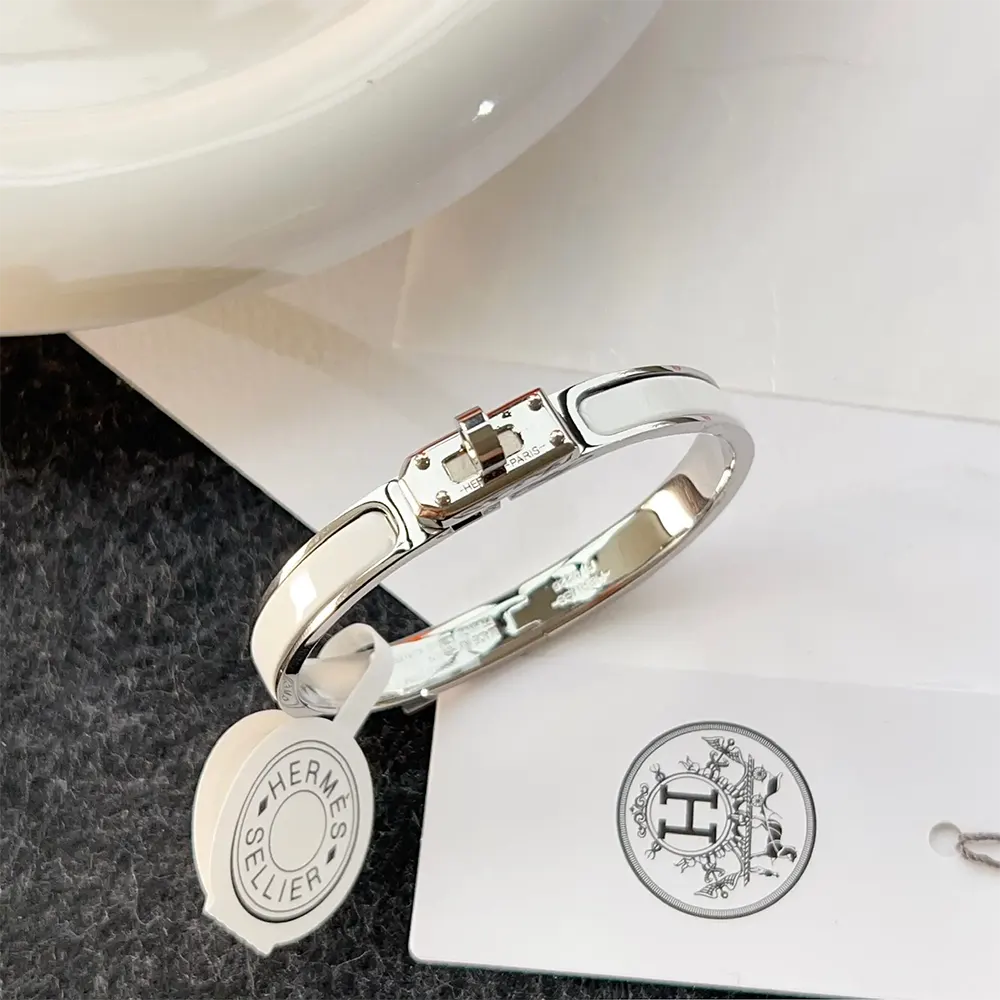 Hermes Unisex Mini Clic Kelly Bracelet-White worn on wrist, full bracelet angle