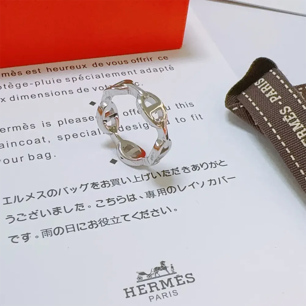 Side view showing delicate silhouette of Hermes Women Chaine D Ancre Enchainee Ring Small Model