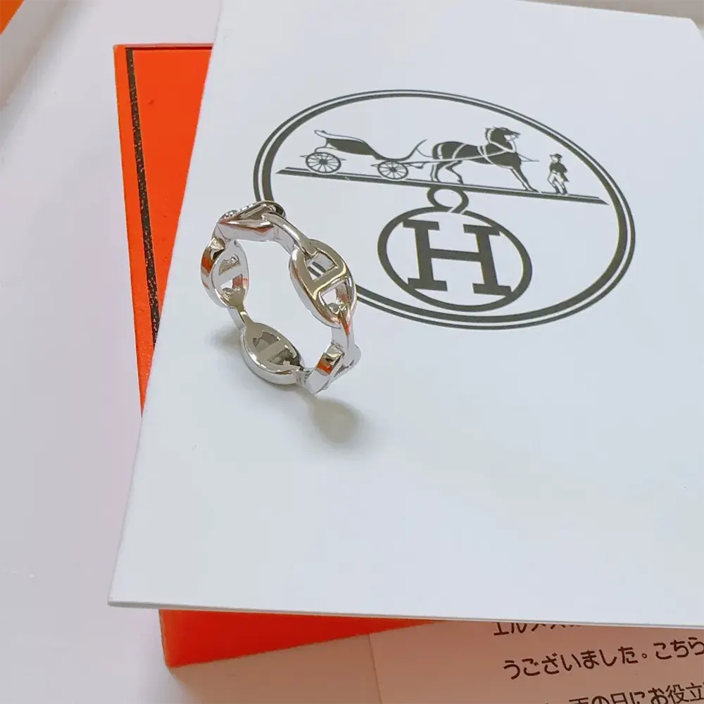 Hermes Women Chaine D Ancre Enchainee Ring Small Model worn on slender finger, silver shine