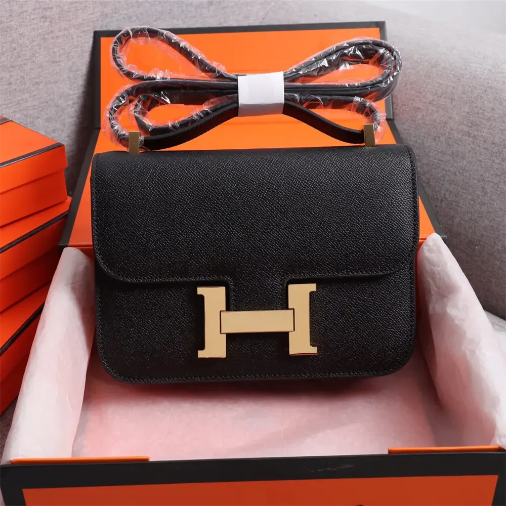 Close-up of gold ‘H’ clasp on Hermes Women Constance 18 Bag