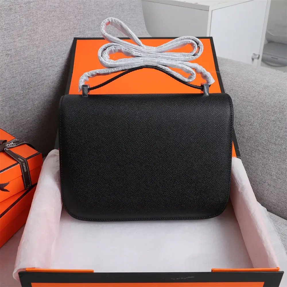 Side angle showing texture of black Epsom leather on Hermes Women Constance 18 Bag