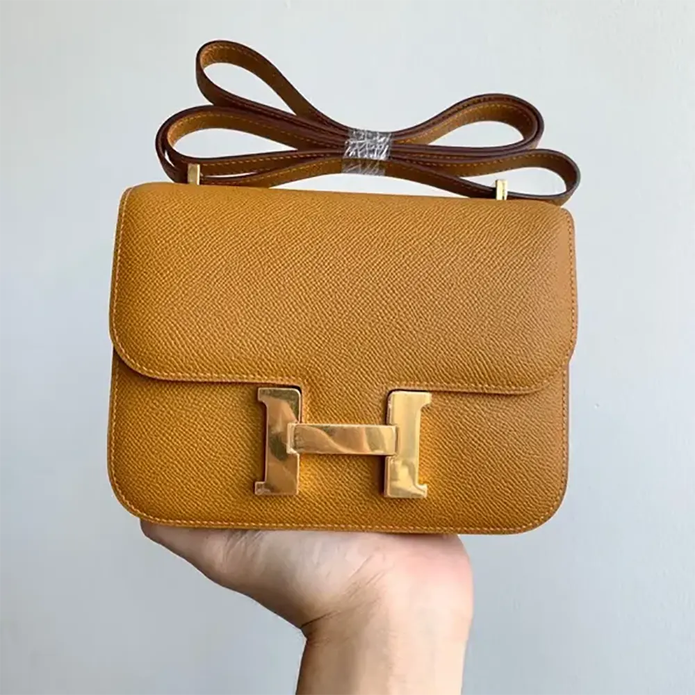Close-up of gold H clasp on Hermes Women Constance 18 Bag