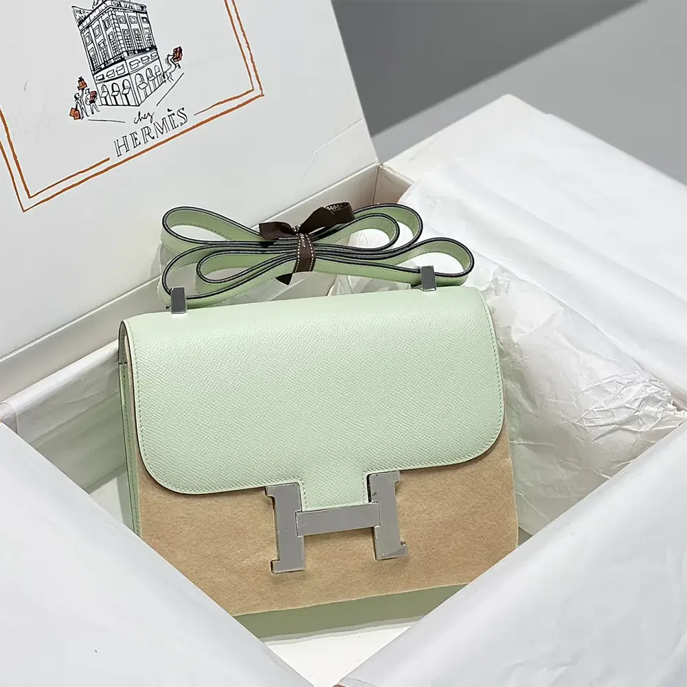 Side angle showing slim profile of Hermes Women Constance 18 Bag