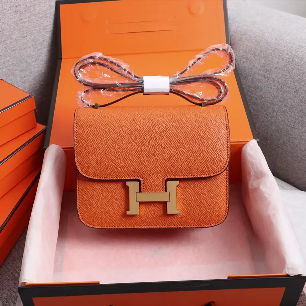 Close-up of gold H clasp on Hermes Women Constance 18 Bag