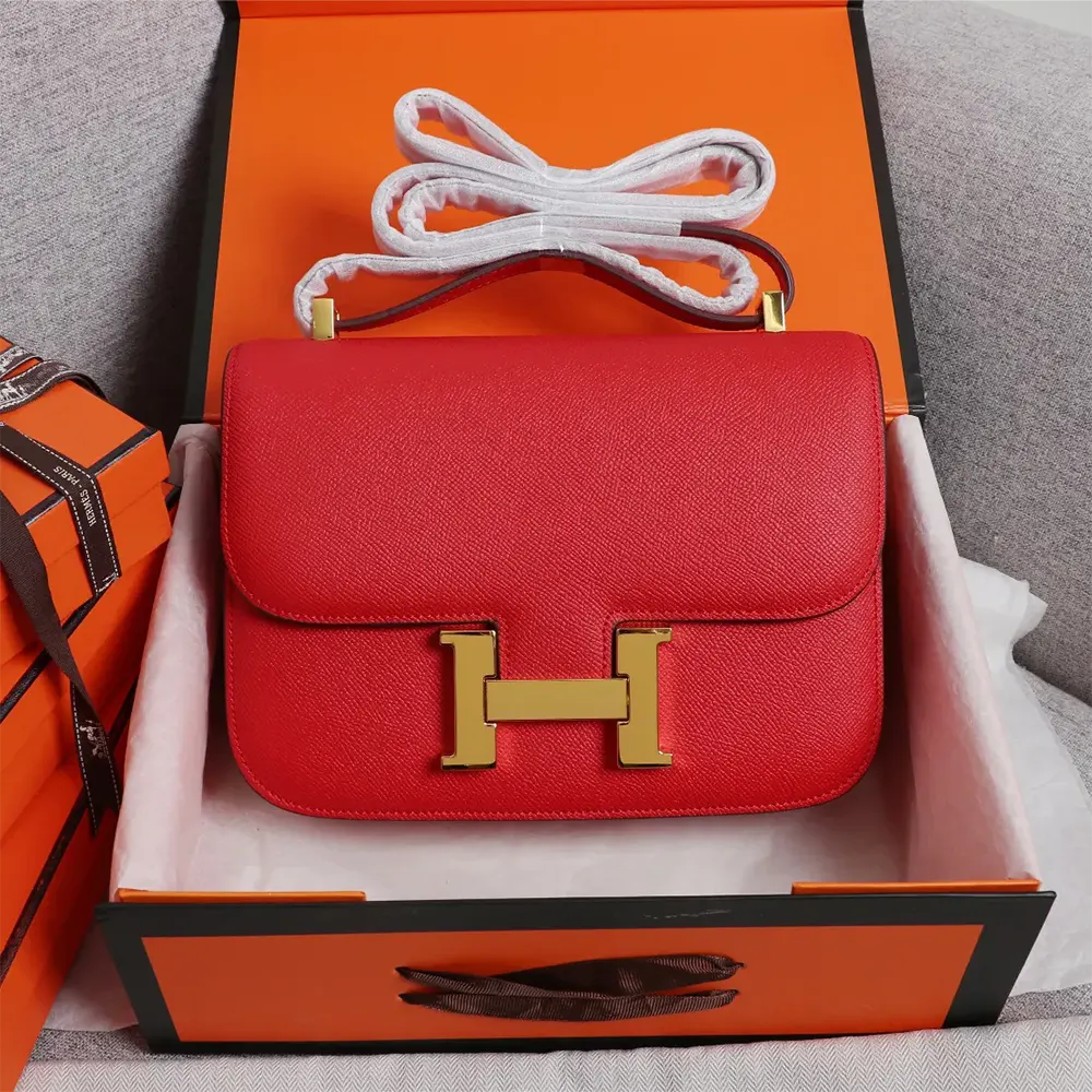 Close-up of gold clasp on Hermes Women Constance 18 Bag