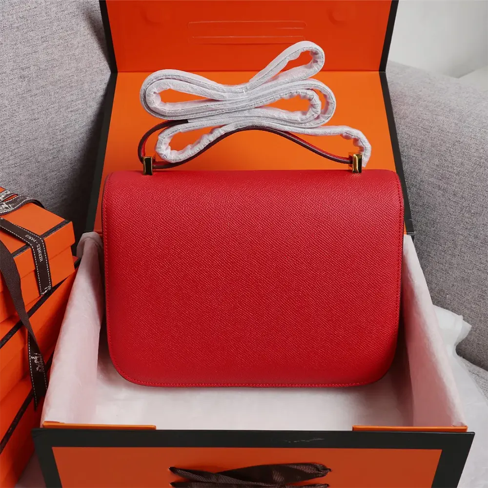 Side profile of Hermes Women Constance 18 Bag in red leather