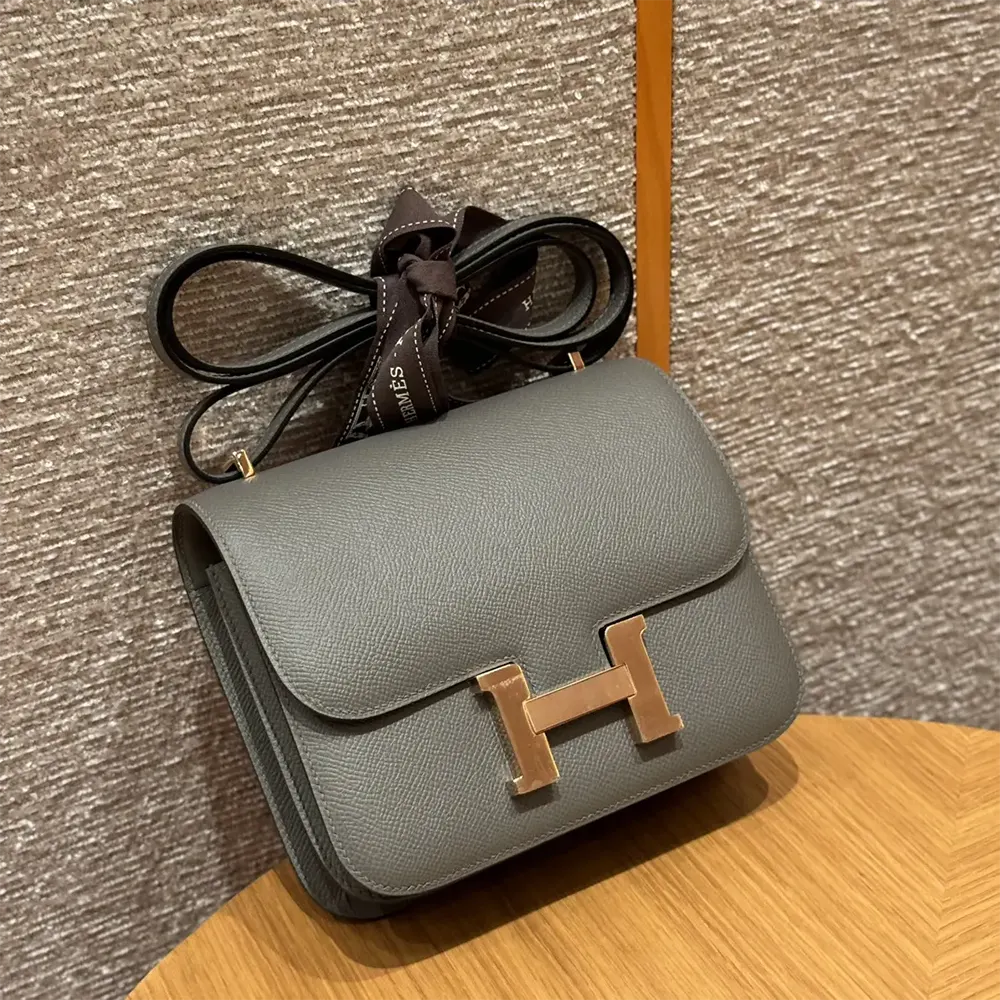 Close-up of signature H clasp on Hermes Women Constance 18 Bag