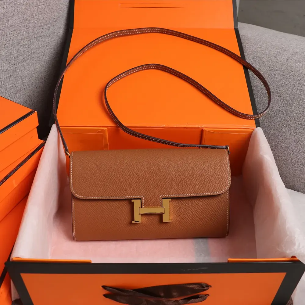 Close-up of gold 'H' clasp on Hermes Women Constance Long To Go