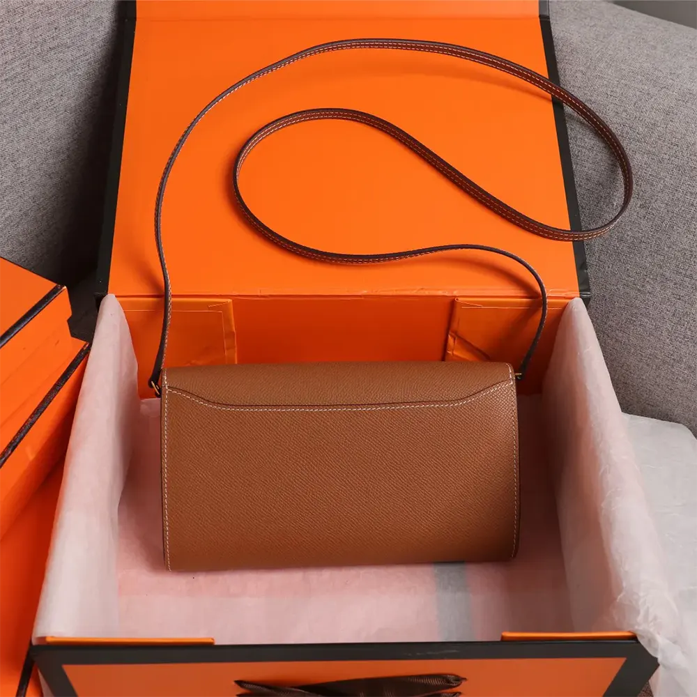 Side angle showing silhouette and shoulder strap on Hermes Women Constance Long To Go