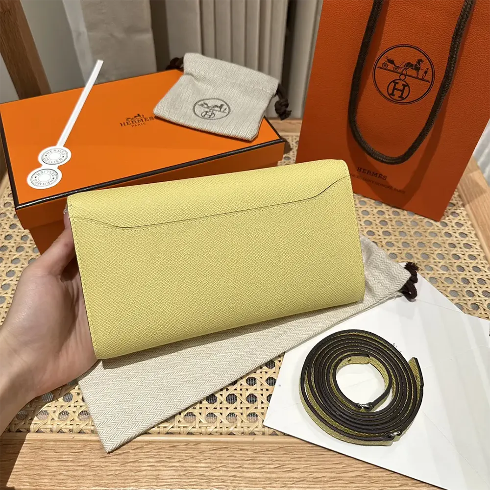 Side profile showing slim silhouette of Hermes Women Constance Long To Go bag