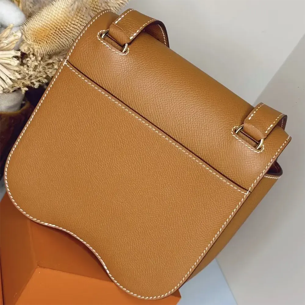 Side profile showing structured silhouette of Hermes Women Della Cavalleria Mini Bag