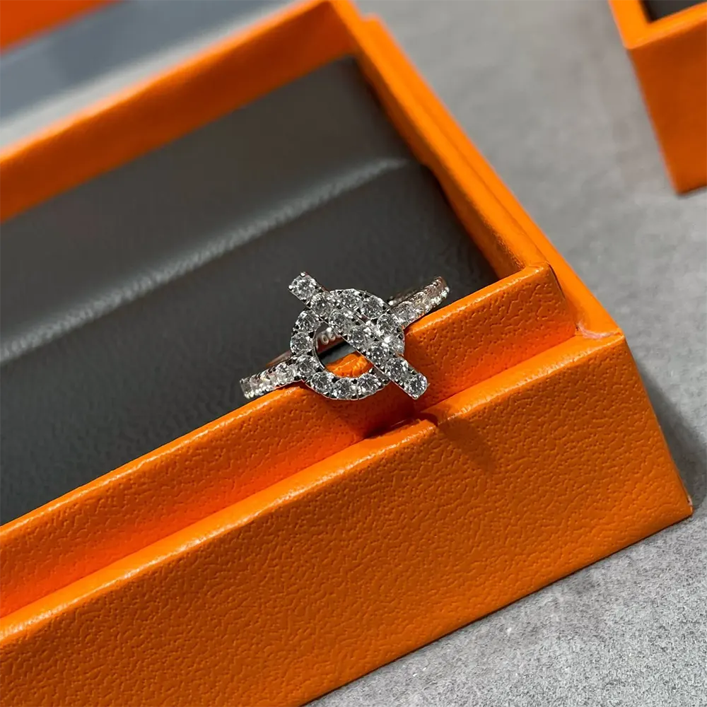 Top angle highlighting signature engraving on Hermes Women Finesse Ring H219610B