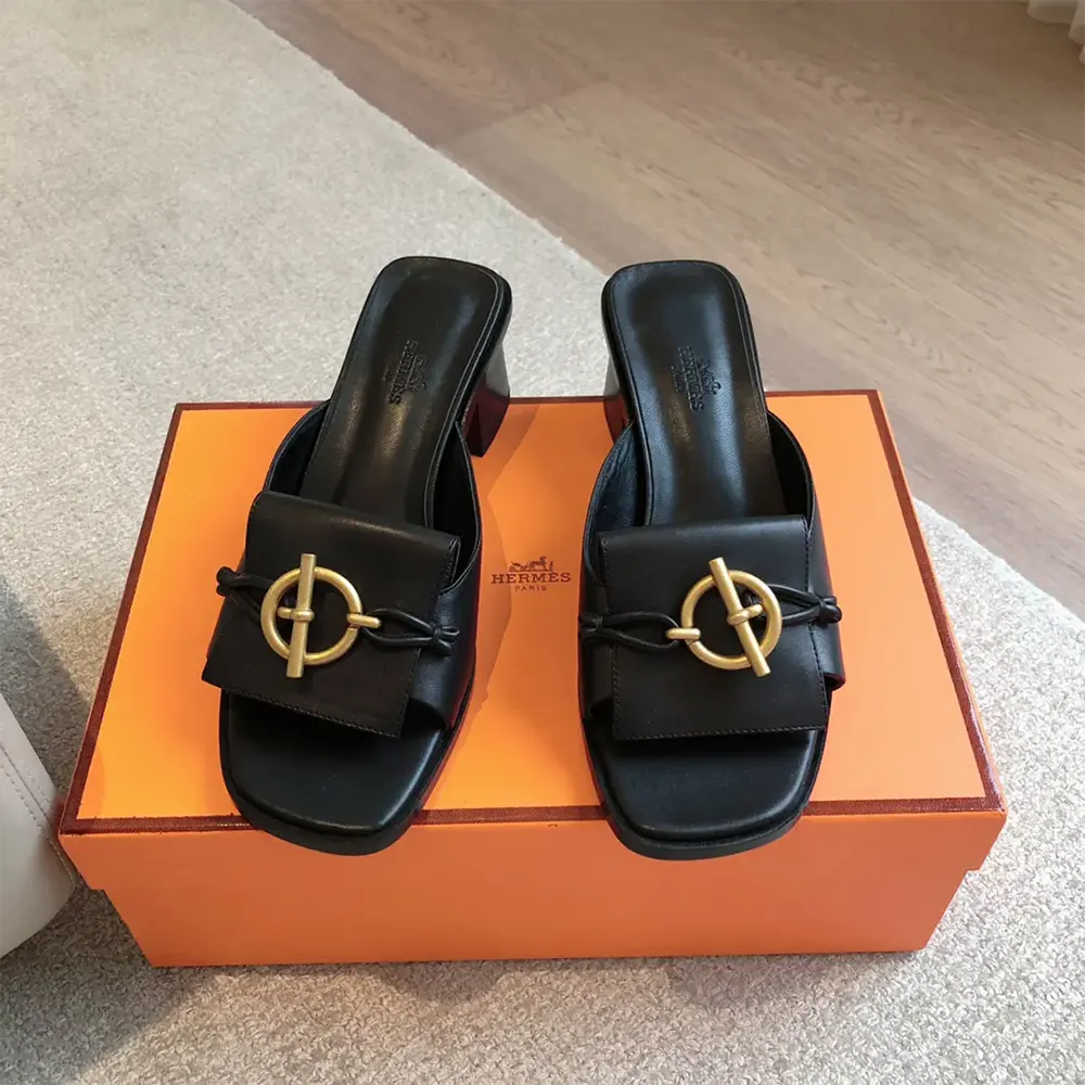 Front angle showing sleek high heel silhouette of Hermes Women Ilot 50 Sandal