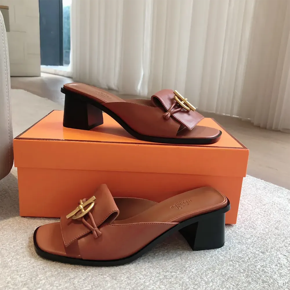 Close-up of buckle hardware on Hermes Women Ilot 50 Sandal brown