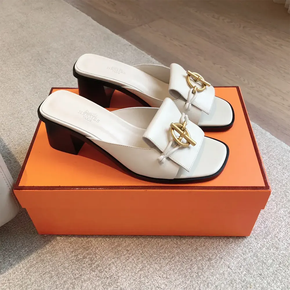 Close-up detail of Hermes H cut-out on white Ilot 50 Sandal