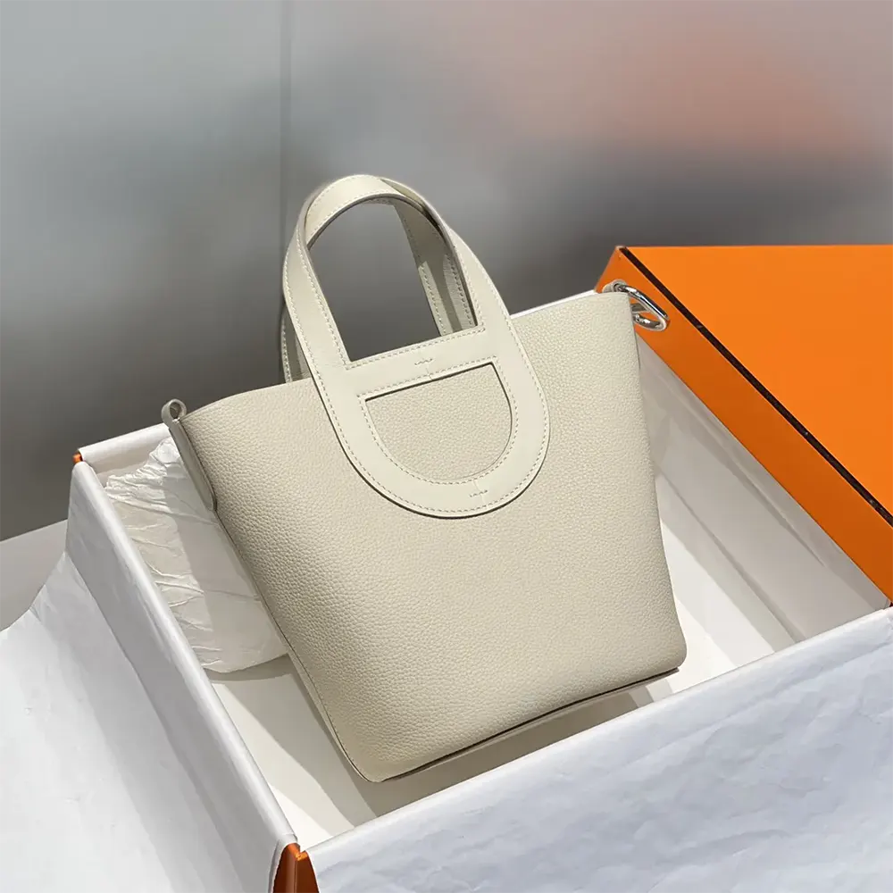 Close-up of silver hardware on Hermes Women In the Loop 18 Handbag white leather