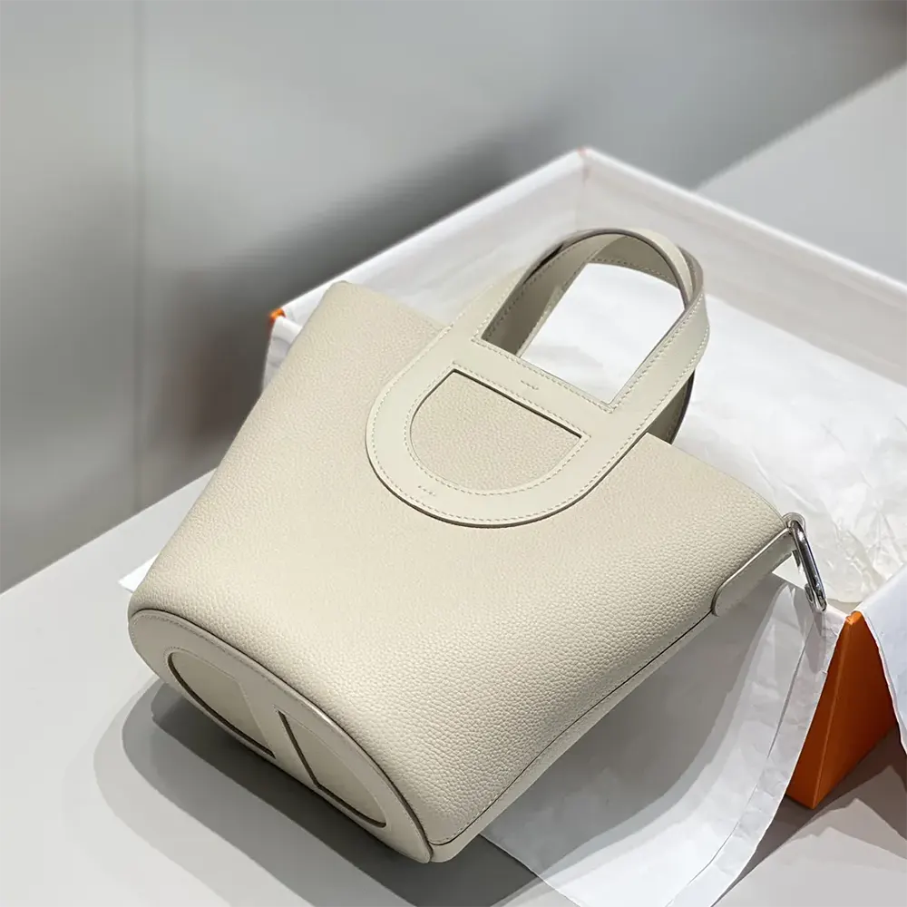 Side angle showing Clemence leather texture on Hermes Women In the Loop 18 Handbag