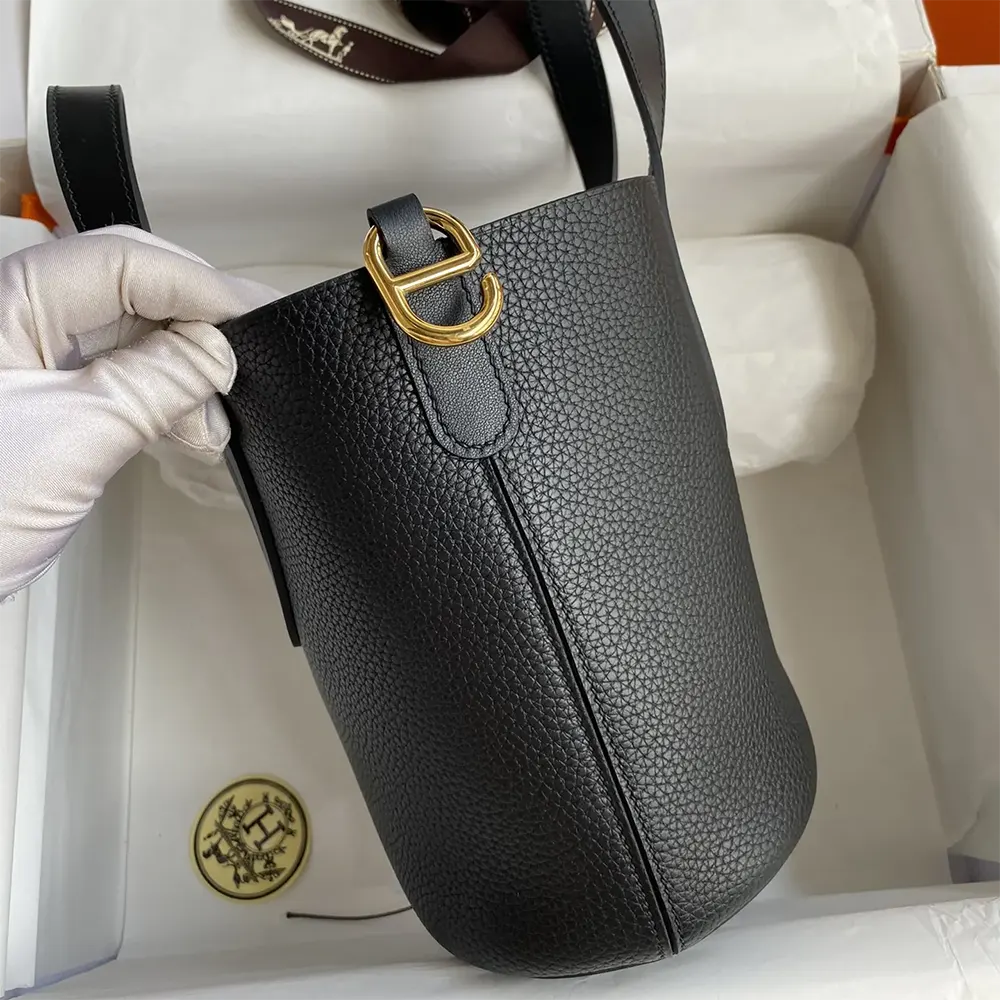Side angle showing silhouette of Hermes Women In the Loop 18 Handbag in black leather