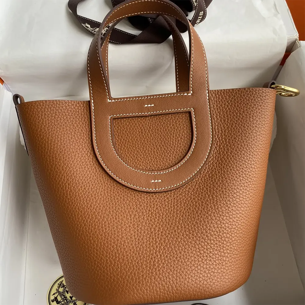 Close-up of gold clasp detail on Hermes Women In the Loop 18 Handbag